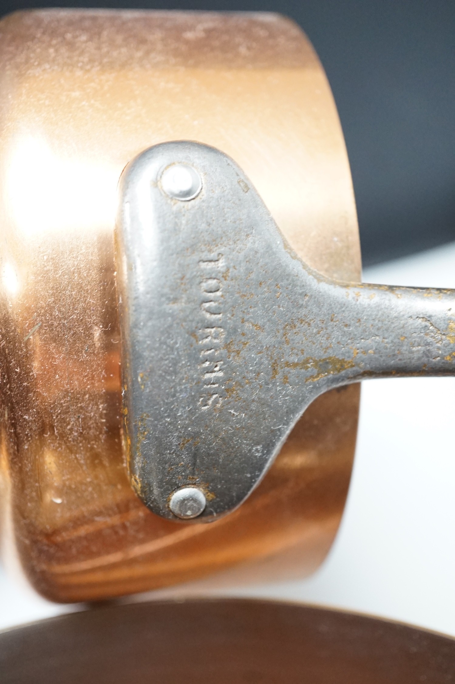 A set of French graduated copper saucepans, batterie de cuisine